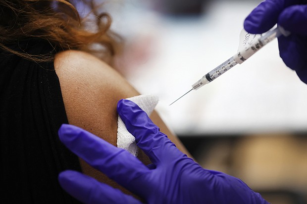 A nurse administers a second Covid-19 booster shot to a patient at Edward Hines Jr. VA Hospital on April 01, 2022 in Hines, Illinois.
Mandatory Credit:	Scott Olson/Getty Images