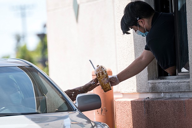 Starbucks has stopped rewarding its stockholders. Pictured is the drive-thru window of a Starbucks store in El Cerrito, California on June 10, 2020.
Mandatory Credit:	David Paul Morris/Bloomberg/Getty Images