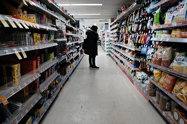 People shop in a store in Brooklyn on March 10, 2022 in New York City. The Federal Reserve's fight against inflation will spark a recession in the United States that begins late next year, Deutsche Bank warned on April 5.
Mandatory Credit:	Spencer Platt/Getty Images