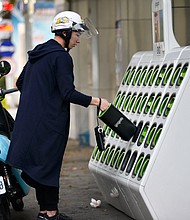 A rider swapping batteries at a Gogoro GoStation in Taipei in 2018. Gogoro, a Taiwanese electric scooter startup that's backed by Al Gore and one of Apple's biggest suppliers, is about to have its day on Wall Street.
Mandatory Credit:	CHRIS STOWERS/AFP/Getty Images