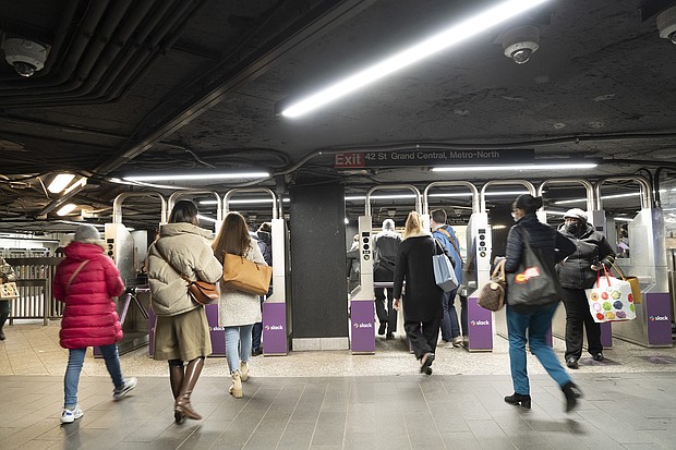 Commuters are seen here at the Grand Central subway station in New York on March 28. More workers are returning to the office after working from home for the last two years.
Mandatory Credit:	Eilon Paz/Bloomberg/Getty Images