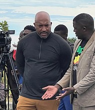 Dr. Michael Jones, left, and Apostle Sunday Sinyangwe, founder of the Chibombo branch of Shalom Embassy Ministries International, converse in Chibombo, Zambia, during Dr. Jones’ mission trip to the East African nation in late March.