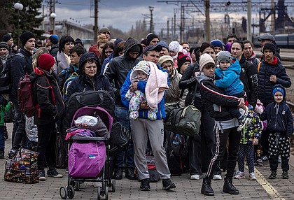 Families arrive at the main train station as they flee the eastern city of Kramatorsk, in the Donbass region on April 4, 2022, amid Russian invasion of Ukraine