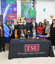 Seated, Dr. Lesia L. Crumpton-Young, TSU President, and Lee Kinnebrew, Southwest’s Vice President of Flight Operations surrounded by TSU’s Aviation program students and United Airlines
