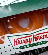 Every Wednesday through May 4, Krispy Kreme is selling a dozen original glazed doughnuts at the price of gas.
Mandatory Credit:	Scott Olson/Getty Images