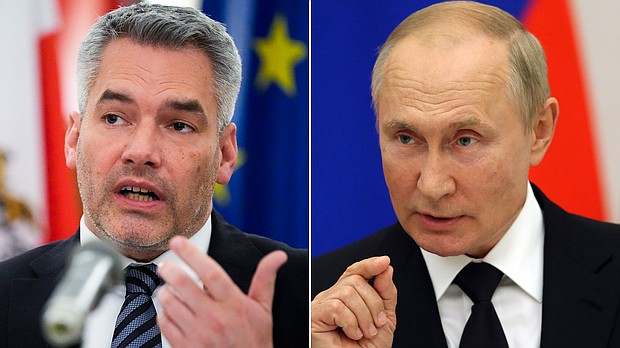 Austria's Chancellor Karl Nehammer, left, met with Vladimir Putin to 'confront' him with atrocities he saw in Ukraine.
Mandatory Credit:	Associated Press