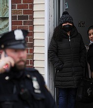 Their Brooklyn neighborhood felt like a safe haven in a big city. The Brooklyn subway attack changed that. People are seen looking out at the scene of a shooting at a subway station in the Brooklyn borough of New York City, New York on April 12.
Mandatory Credit:	Brendan McDermid/Reuters