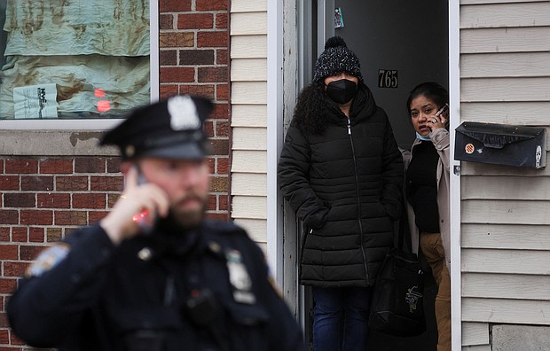 Their Brooklyn neighborhood felt like a safe haven in a big city. The Brooklyn subway attack changed that. People are seen looking out at the scene of a shooting at a subway station in the Brooklyn borough of New York City, New York on April 12.
Mandatory Credit:	Brendan McDermid/Reuters