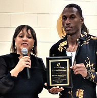 Dr. Madeline G. McClenney of The Exodus Foundation presents Wize Shahid with an award last Friday during a celebration of his release from prison held at First Baptist Church Centralia.