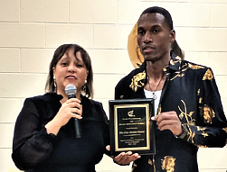 Dr. Madeline G. McClenney of The Exodus Foundation presents Wize Shahid with an award last Friday during a celebration of his release from prison held at First Baptist Church Centralia.