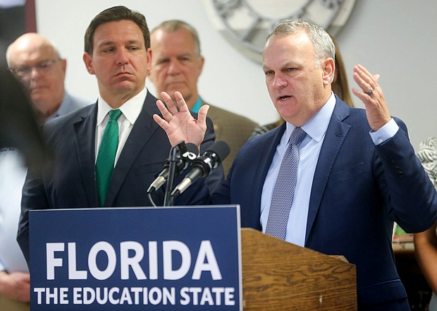 Florida Department of Education Commissioner Richard Corcoran, right, speaks alongside Gov. Ron DeSantis at a news conference on March 17.
Mandatory Credit:	Michael Snyder/The Northwest Florida Daily News/USA Today Network
