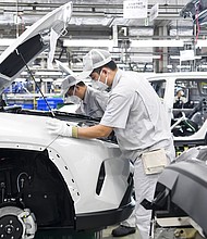 Toyota, Volkswagen and Tesla are bringing factories in China back on line. Chinese workers are here seen at the assembly line at a plant of FAW-Toyota in Changchun City, China on February 17th, 2020.
Mandatory Credit:	Costfoto/Future Publishing/Getty Images