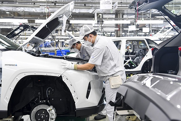 Toyota, Volkswagen and Tesla are bringing factories in China back on line. Chinese workers are here seen at the assembly line at a plant of FAW-Toyota in Changchun City, China on February 17th, 2020.
Mandatory Credit:	Costfoto/Future Publishing/Getty Images
