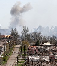 Smoke rises above the Azovstal steel plants in Mariupol on April 18.
Mandatory Credit:	Alexander Ermochenko/Reuters