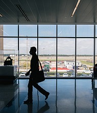 A traveler walks through the George Bush Intercontinental Airport on December 03, 2021 in Houston. A federal judge in Florida struck down on Monday the CDC mask mandate for travelers .
Mandatory Credit:	Brandon Bell/Getty Images
