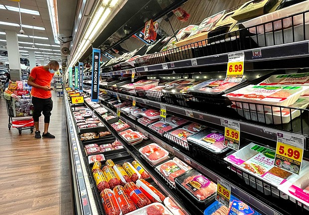 A person shops in the meat section of a grocery store on November 11, 2021 in Los Angeles, California. Consumers around the world are paying more for goods and services.
Mandatory Credit:	Mario Tama/Getty Images