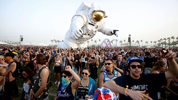 Concertgoers dance around a large-scale moving sculpture called "Escape Velocity" at Coachella in 2014. The festival will be streaming online courtesy of Coachella's channel on YouTube.
Mandatory Credit:	Mario Anzuoni/Reuters