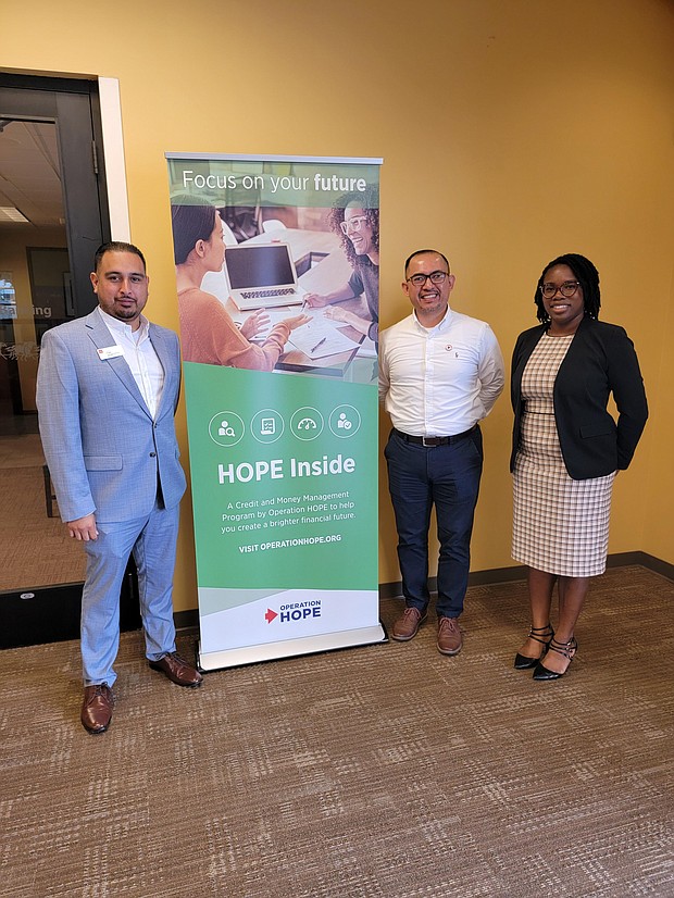 Photo: (Left to Right) Branch Manager Franklin Luna, Operation HOPE Coach Luis Jaramillo Chan, and District Manager Tanya McCarter at the Port City Branch HOPE center.