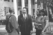 Dr. Harvey talks with students outside Mansion House, the president’s residence, located on the waterfront on the Hampton University campus. The house, built in 1828, was the main house for the plantation called Little Scotland that once stood on the grounds.