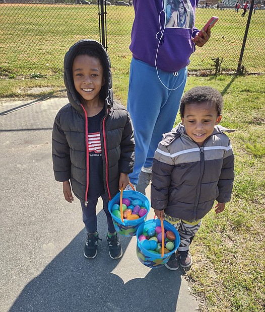 Jorel Jones, left, and his brother, Jordan, show off their impressive haul from the first annual Easter Egg Extravaganza held Sunday by the nonprofit No Residue & Co. at Lucks Field in the East End. The boys attended the egg hunt with their aunt, Briauna Saunders, and other relatives. They were among more than 60 children, mainly from Mosby Court, who participated in the fun family event. The Richmond Alumni Chapter of Kappa Alpha Psi Fraternity and P&F Contracting supported the event, with a team from the home renovation firm handling the cookout. Participants also received COVID-19 home test kits.