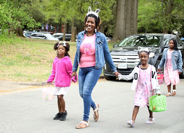 Ruby Tate of Henrico County, center, arrived early with her niece, Lyric Harris, 6, left, and her daughters, Mya Tate, 5, front right, and Lauren Tate, 8, and spent a few hours at the celebration before heading home.
