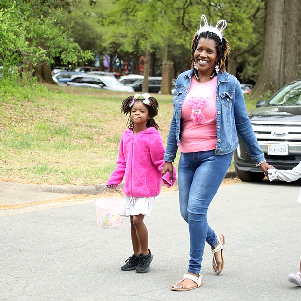 Ruby Tate of Henrico County, center, arrived early with her niece, Lyric Harris, 6, left, and her daughters, Mya Tate, 5, front right, and Lauren Tate, 8, and spent a few hours at the celebration before heading home.