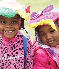 Best friends Aniah Jones, 6, left, and Amyah Tillman, 4, model Easter bonnets they created with helping hands from their mothers, Samiah Jones and Shanya James, during the Dominion Energy Family Easter at Maymont last Saturday.