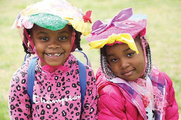 Best friends Aniah Jones, 6, left, and Amyah Tillman, 4, model Easter bonnets they created with helping hands from their mothers, Samiah Jones and Shanya James, during the Dominion Energy Family Easter at Maymont last Saturday.