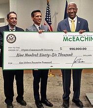 Congressman A. Donald McEachin, second from right, presents Virginia Commonwealth University officials with a ceremonial check representing a federal grant for its Gun Violence Prevention Framework. With him at the April 14 news conference are, from left, Sheryl Garland, VCU Health Innovation director; Dr. Michel B. Aboutanos, medical director of the VCU Trauma Center; VCU President Michael Rao; and Richmond Commonwealth’s Attorney Colette W. McEachin, who is the wife of Rep. McEachin.