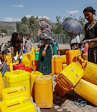 Civilians fill plastic containers with water in Lalibela, a town in northern Ethiopia, on March 31. Tigrayan forces say they are withdrawing from Ethiopia's Afar region.
Mandatory Credit:	J. Countess/Getty Images