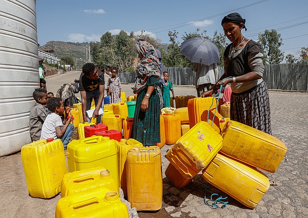 Civilians fill plastic containers with water in Lalibela, a town in northern Ethiopia, on March 31. Tigrayan forces say they are withdrawing from Ethiopia's Afar region.
Mandatory Credit:	J. Countess/Getty Images