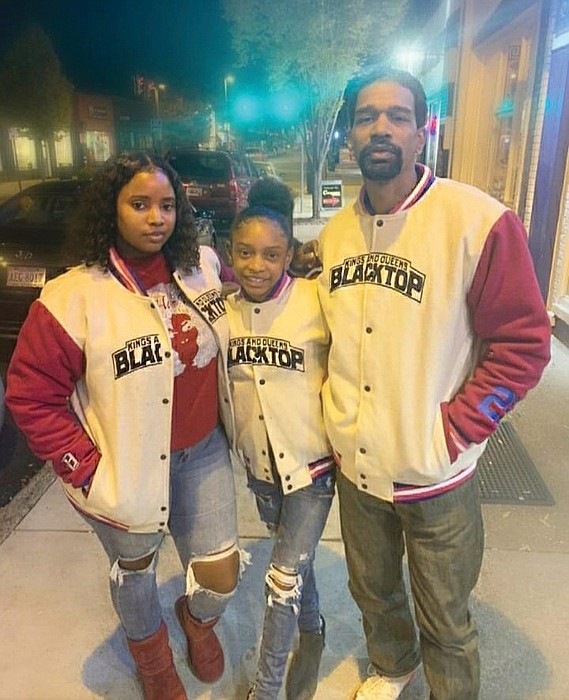 From left, wife, Tiffany Harris; daughter, Ti-Mani Harris, 13; and Arthur E. “Manny” Harris Jr.