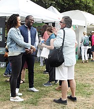 Spotted among the throngs of people are Richmond Mayor Levar M. Stoney and his fiancée, Brandy Washington, who paused to talk and laugh with James Mercante, the assistant director for public affairs with the Richmond Police Department.