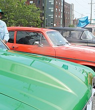 Jerry Wyatt, 64, of Mechanicsville proudly stands beside his shiny green 1969 Chevrolet Nova, just one of the classic cars that filled the parking lot Saturday at the Richmond Heritage Federal Credit Union, 50 W. Commerce Road in South Side. The show and sale of the restored cars celebrated the 86th birthday of the financial institution that Black Richmond teachers and Virginia Union University professors organized in 1936 during the Great Depression as a self- help organization. Long based in Jackson Ward, the member-owned credit union purchased this site in South Richmond in 2000 for its headquarters.