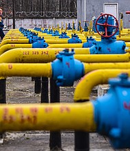 Gas station worker walks near gas pipes at a natural gas station during the installation of complex gas preparation at the Ukrgasvydobuvannya UCPG facility.
Mandatory Credit: Mykola Tys/SOPA Images/LightRocket/Getty Images