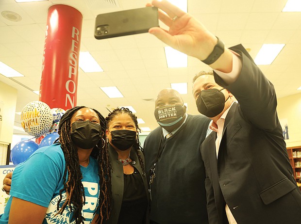 Richmond Teacher of the Year Kiara S. Thompson, left, happily pauses last Friday for a selfie with other former honorees who shared in her joy, including Boushall Middle School Principal LaTonya Waller, who was Virginia Teacher of the Year in 2011; Rodney A. Robinson, second from right, the National Teacher of the Year in 2019; and Superintendent Jason Kamras, the National Teacher of the Year in 2005. Ms. Thompson will represent Richmond Public Schools in the state’s consideration of Region One Teacher of the Year.