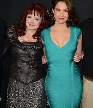 Naomi Judd (left), seen here in March 2013 in Los Angeles, died of a self-inflicted firearm wound, Ashley Judd reveals.
Mandatory Credit: Jordan Strauss/Invision/AP
