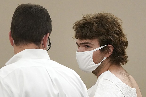 Authorities say the suspect Payton Gendron, pictured here during his arraignment in Buffalo City Court, who fatally shot 10 people and injured three others at a Buffalo supermarket in the heart of the city's Black community traveled from another New York county hours away.
Mandatory Credit:	Mark Mulville/AP