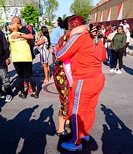 People embrace outside the scene of a shooting at a supermarket, in Buffalo, New York, on May 15.
Mandatory Credit:	Matt Rourke/AP