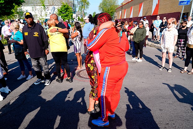 People embrace outside the scene of a shooting at a supermarket, in Buffalo, New York, on May 15.
Mandatory Credit:	Matt Rourke/AP