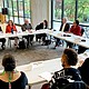 Ivory N. Mathews, the new executive director for Home Forward (upper left), addresses the housing crisis during a meeting in Portland this month with President Biden’s Housing Secretary, Marcia Fudge (center, head table), and other local officials, including members of Oregon’s congressional delegation.