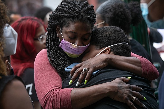 Friends and family mourn the death of Conrad Coleman Jr. following his funeral service on July 3, 2020 in New Rochelle, New York. More than one million Americans have now died of Covid-19 since the pandemic's start, according to Tuesday data from Johns Hopkins University.
Mandatory Credit:	John Moore/Getty Images)