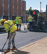 Richmond city workers lay asphalt across the pavement in the 4600 block of West Broad Street last Saturday. The re-pavement is one part of the City of Richmond’s Streetscape project, which began in April and is estimated to be completed by the fall of 2023. Planned changes include improved sidewalk accessibility for wheelchair users, those with visual impairments and others, new greenery and street furniture and other additions and constructions aimed at pedestrian and traffic safety.