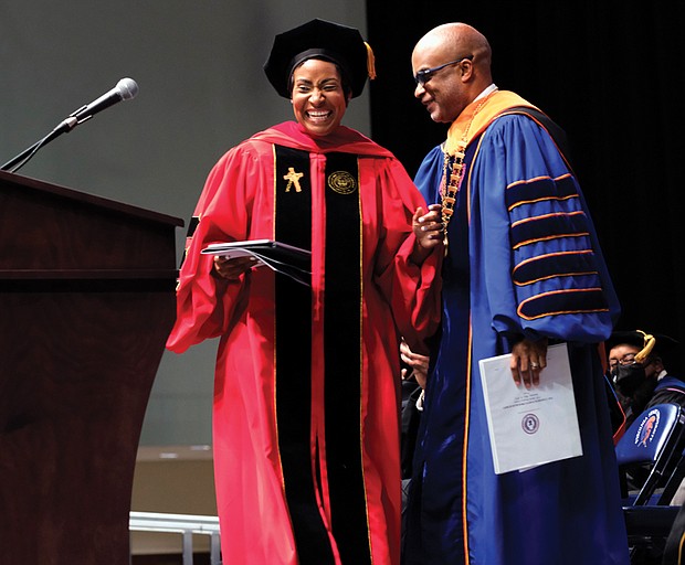 Keynote speaker Dr. Khaalida Forbes and VSU President Makola M. Abdullah, Ph.D. share a laugh during Virginia State University’s commencement.