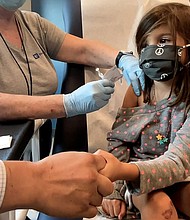 Three child-size doses of the Pfizer/BioNTech Covid-19 vaccine appeared to be safe and showed a strong immune response in children ages 6 months to 5 years, the companies say, and pictured, Bridgette Melo, in Durham, North Carolina September 28, 2021.
Mandatory Credit: Shawn Rocco/Duke University/Reuters