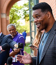 Republican Senate candidate Herschel Walker speaks with reporters after a campaign rally at the Georgia Sports Hall of Fame in Macon on May 18.
Mandatory Credit: Jason Vorhees/AP