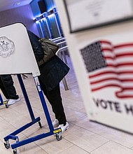 Voters cast ballots at an early voting location in Madison Square Garden in New York City on October 26, 2020.
Mandatory Credit: Jeenah Moon/Bloomberg/Getty Images