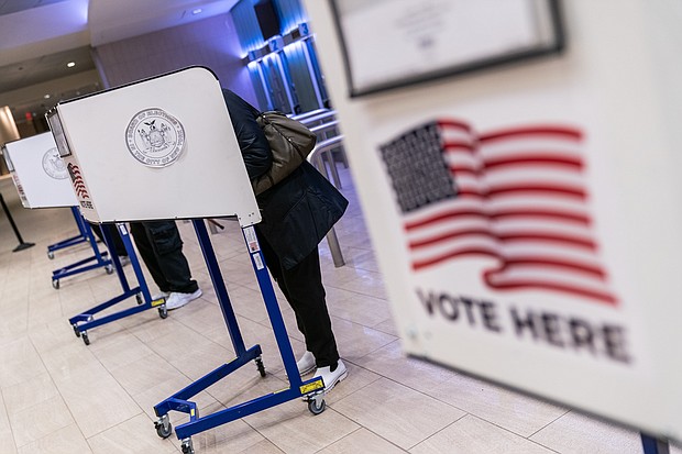 Voters cast ballots at an early voting location in Madison Square Garden in New York City on October 26, 2020.
Mandatory Credit:	Jeenah Moon/Bloomberg/Getty Images