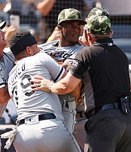 Tim Anderson is restrained by teammate José Abreu during Saturday's game in New York.
Mandatory Credit: Sarah Stier/Getty Images