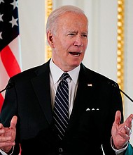 When President Joe Biden stated unequivocally he was willing to intervene militarily to defend Taiwan against a Chinese attack, it was not the first time this city has seen a US president catch his national security aides off guard.
Mandatory Credit:	Evan Vucci/AP